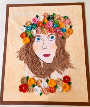 Zdjęcie_nr_7_przedstawia_obrazek_kobiety_namalowany_pastelami._Na_głowie_ma_przyklejone_kolorowe_kwiatki_zrobione_na_szydełku.png